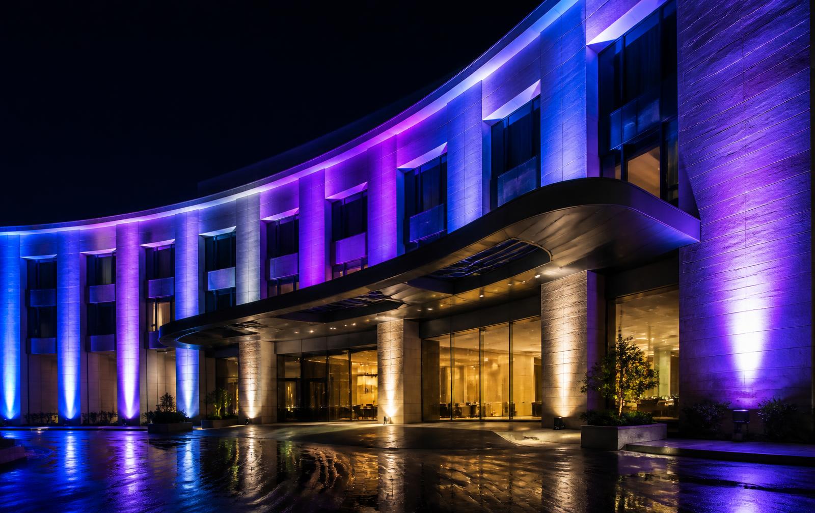 Façade illuminated with Kerr RGBW architectural lighting at night
